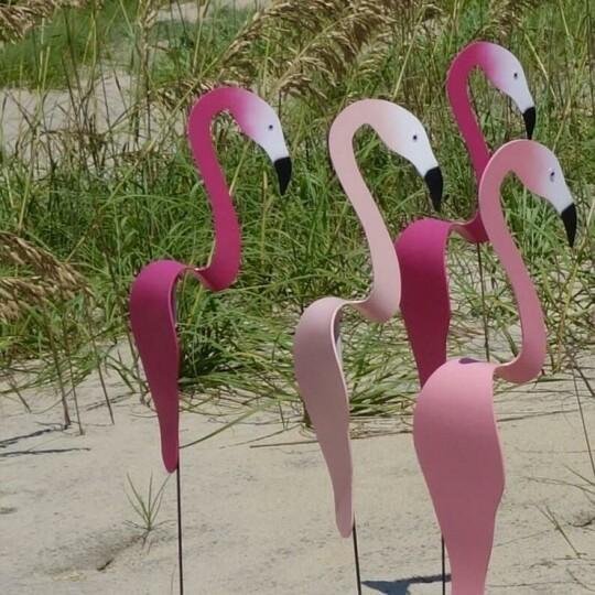 A whimsical and dynamic bird that spins with the slight garden breeze